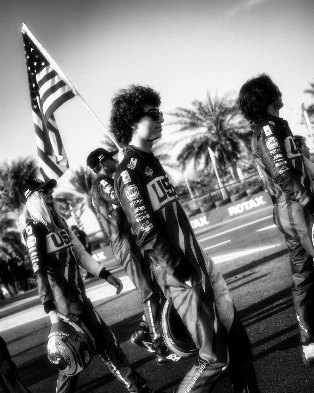 Team USA on the drivers' parade in black and white