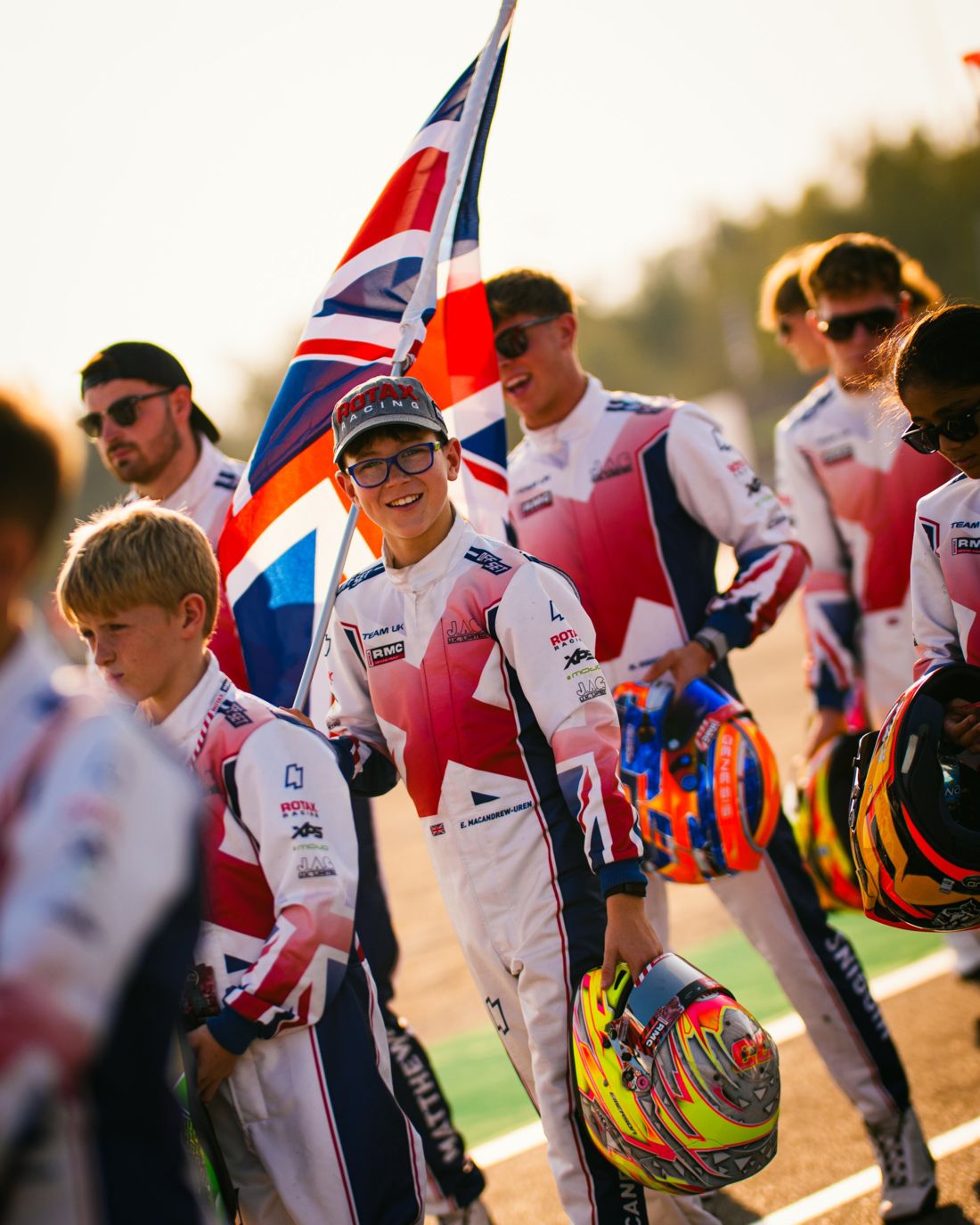 Smiling Team UK driver carries the Union flag