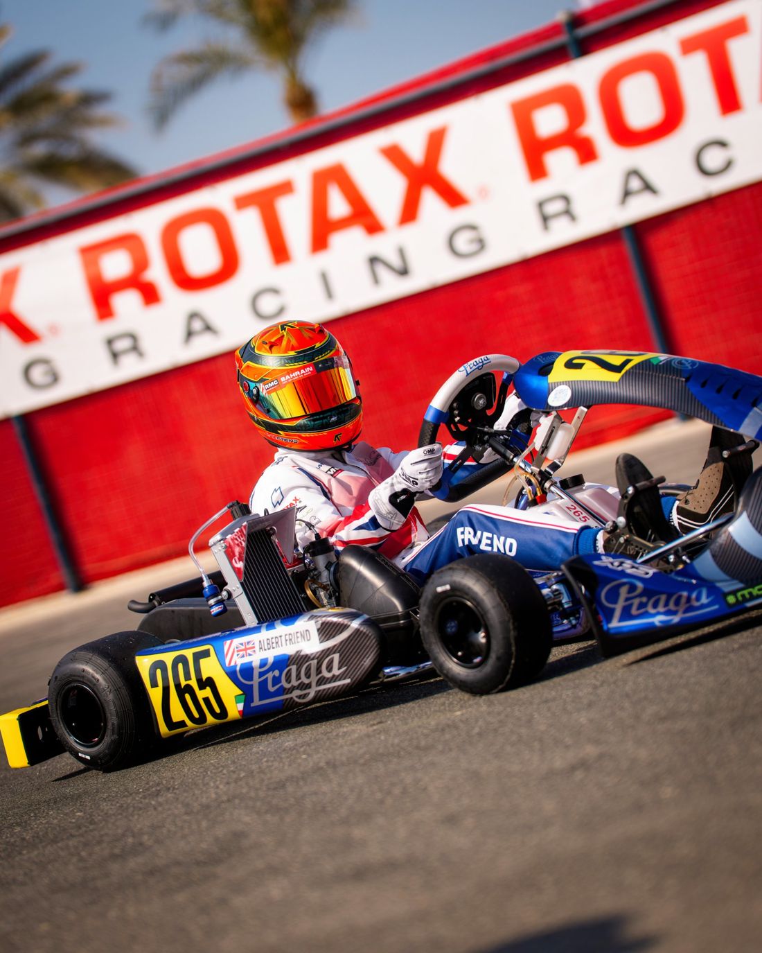 Kart 265 turns past the Rotax Racing wall