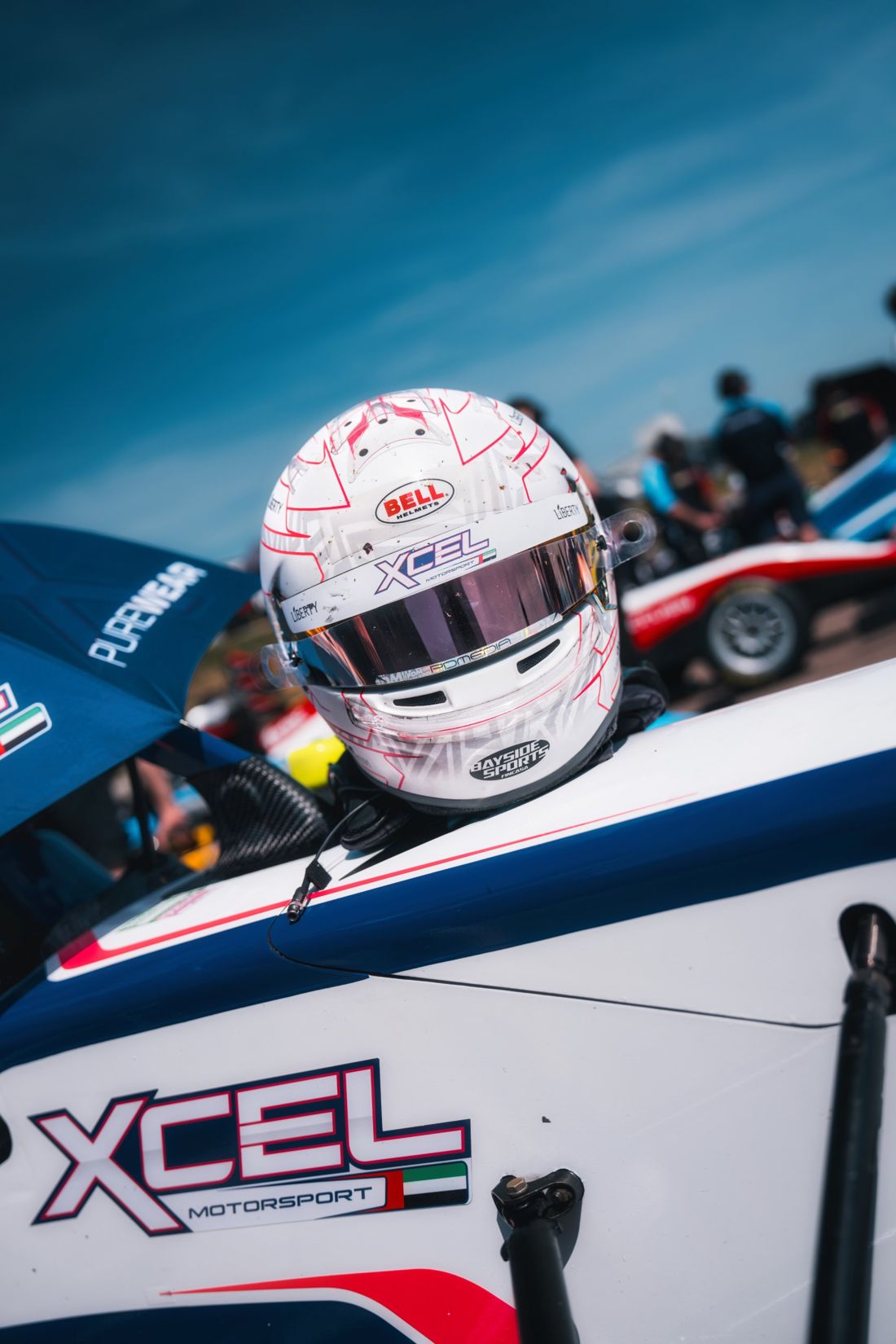 Driver's helmet resting on the cockpit