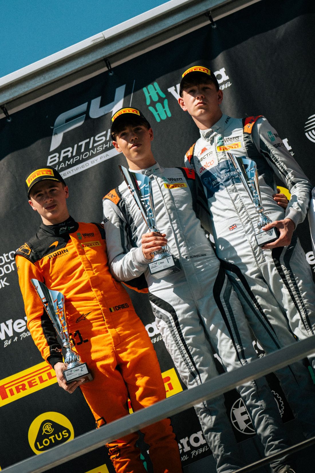Top three on the podium with trophies