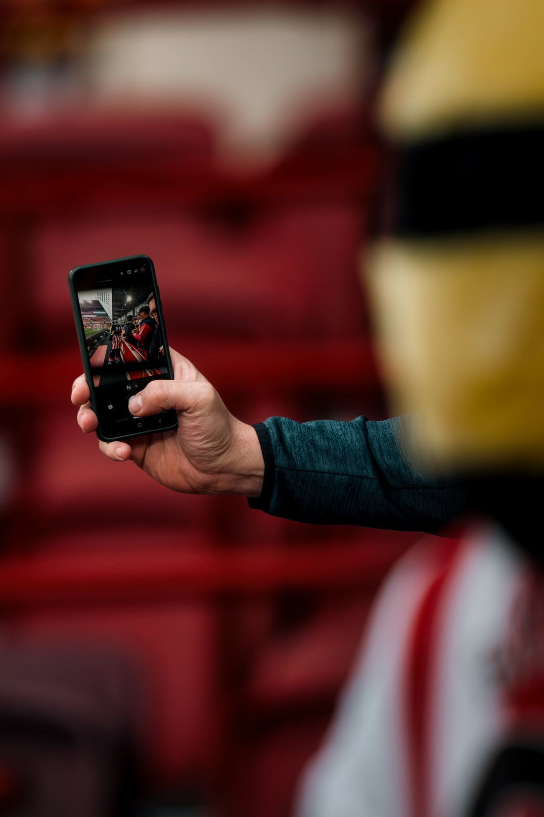 Fan takes a selfie with the mascot