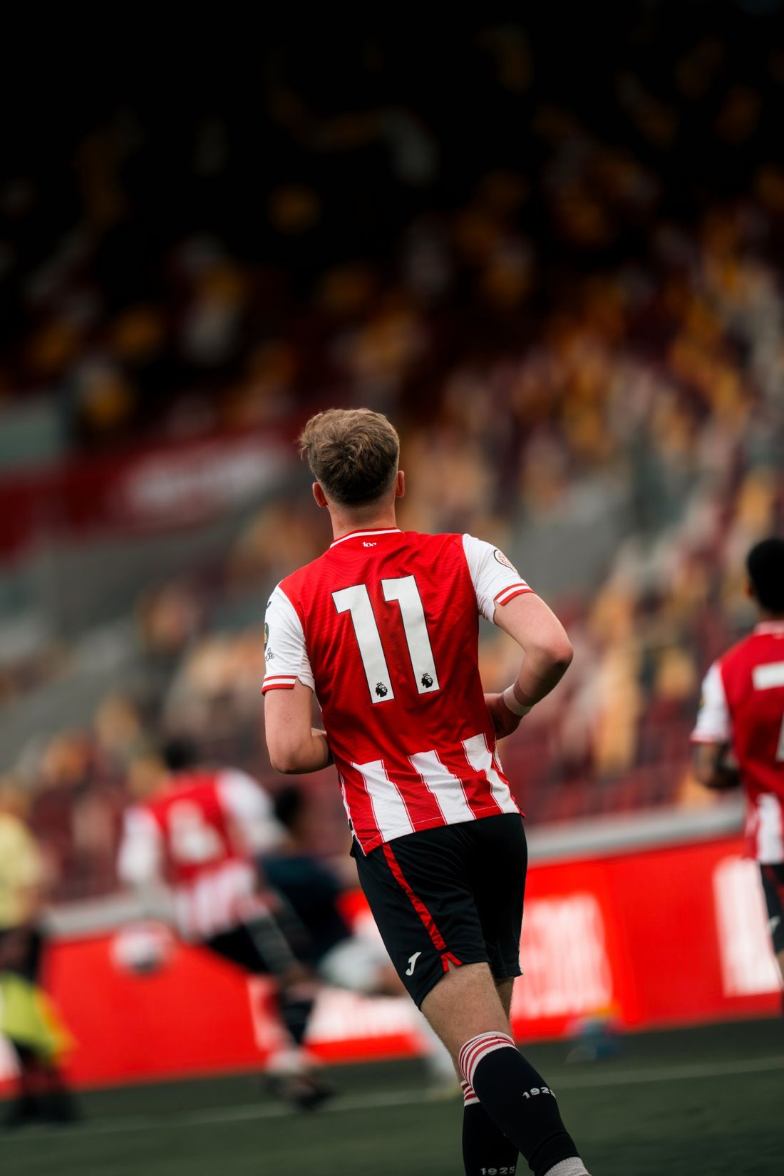 Brentford number 11 jogs back