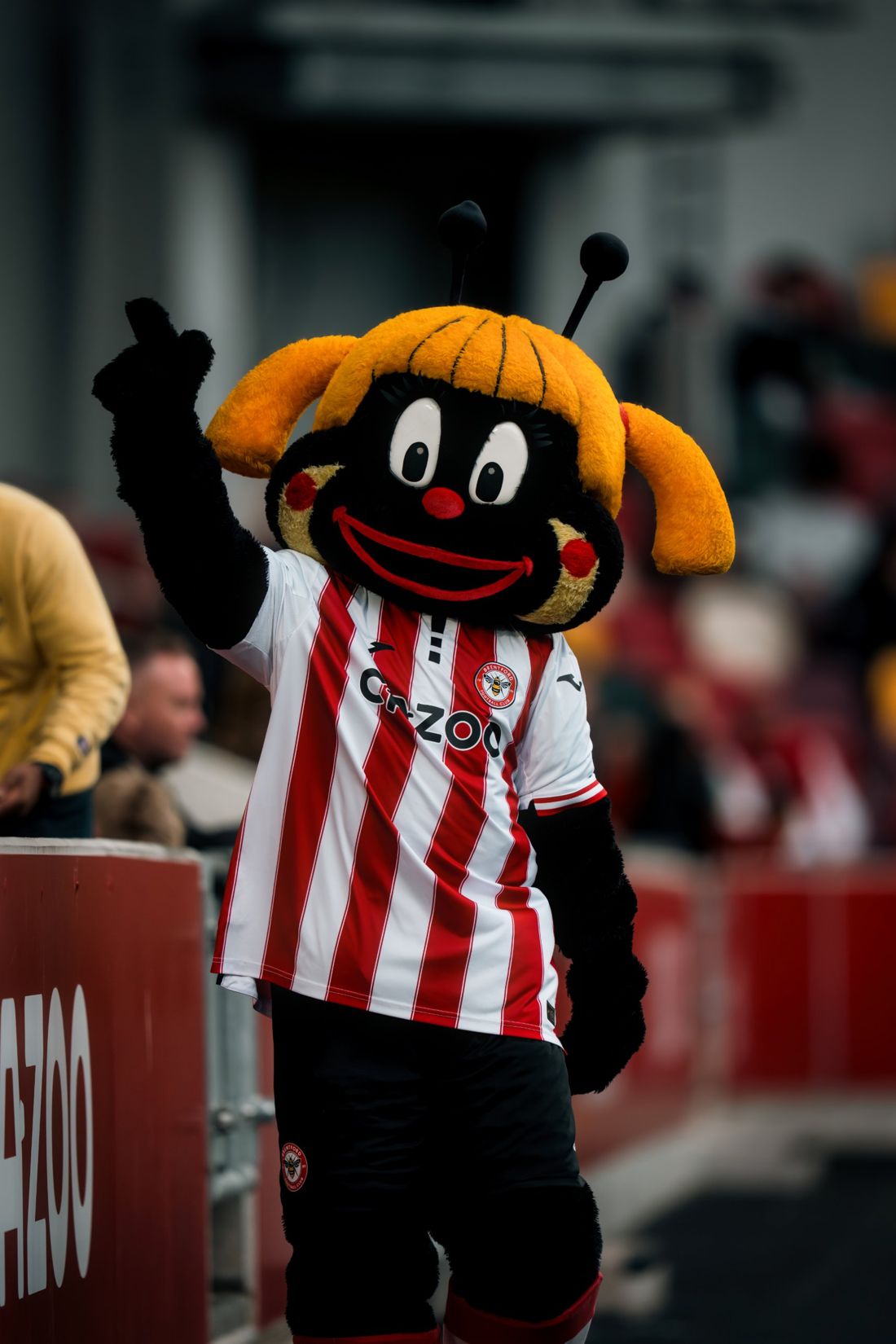 Brentford mascot waves to fans