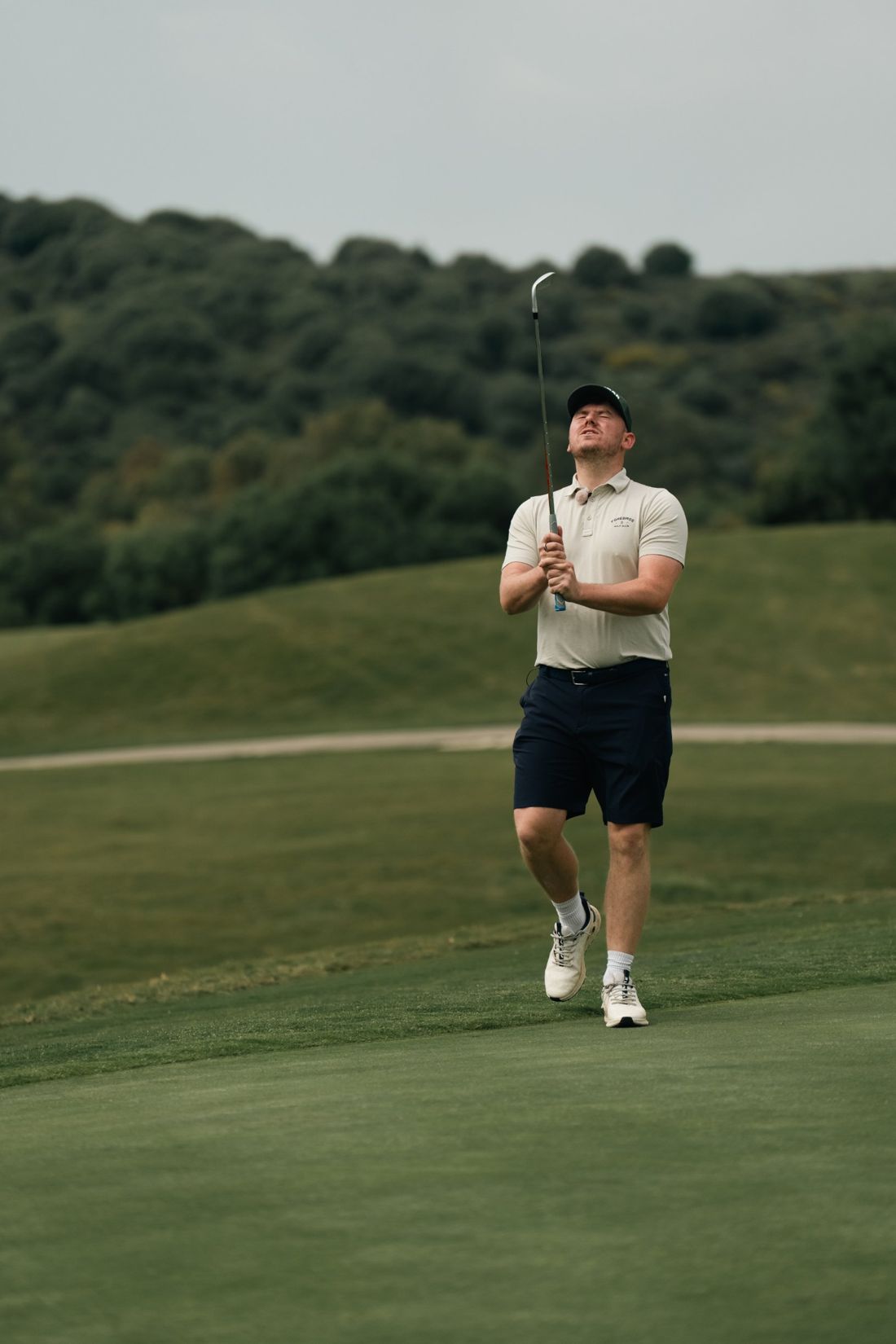 Golfer reacts to a missed shot