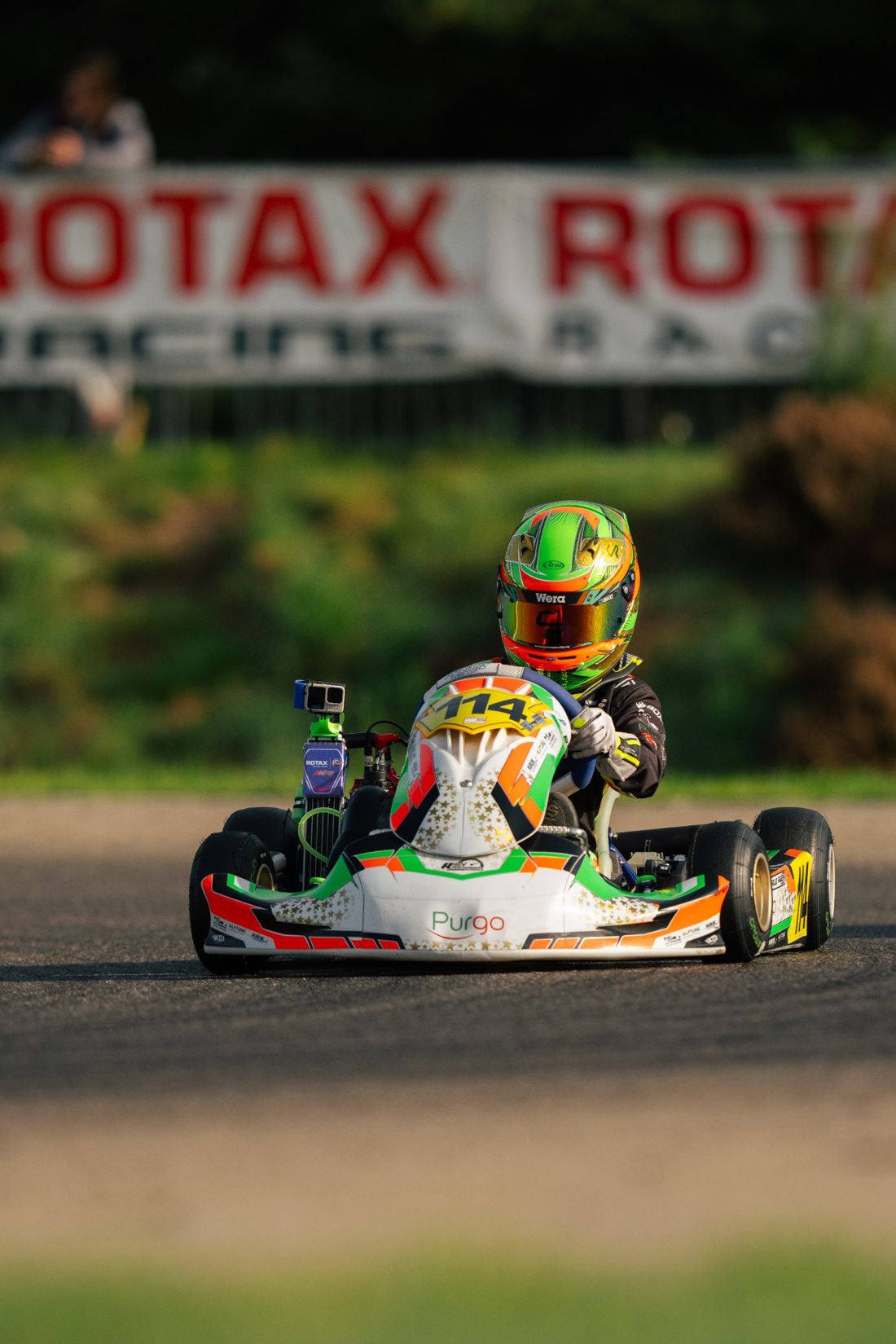 Kart 114 head-on in front of the Rotax banner